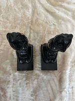 Top view of both black cat bookends showing overall shape and gloss finish