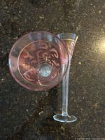 Top view and side of one flute showing pink ombré and gold scroll etching