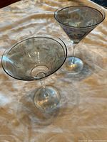 Two etched martini glasses side by side showing overall appearance