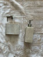 Soap dispenser, toothbrush holder and extra pump laid out