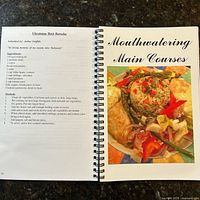 Interior pages with section header ‘Mouthwatering Main Courses’ and recipe layout