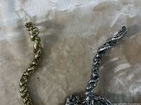 Close-up of silver and gold spiral cords showing texture and finish