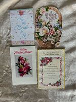 Front view of four bridal shower cards laid out