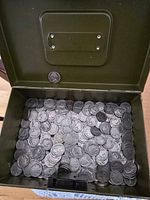 Open metal box filled with Buffalo nickels