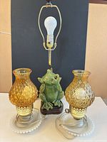 Full view of all three lamps, showing design, shades, harps, bulbs and cords