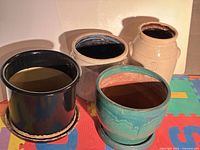 Four crocks/planters grouped