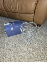 Vase standing beside original blue box showing wear