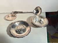 Top view of all four silver-plated pieces