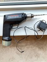 Cordless drill with battery, charger, drill bit
