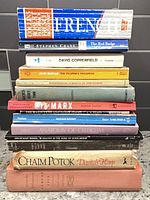 Stack of all 14 books showing spines