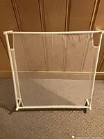 front view of one white plastic mesh drying rack