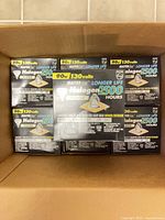 Box containing multiple Philips Masterline halogen flood bulbs