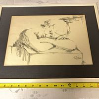 full view of framed sketch with measuring tape for scale