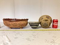 All three ceramic planters with Coke can for scale