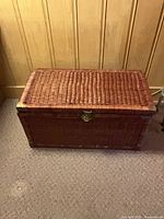 Full view of brown wicker trunk closed