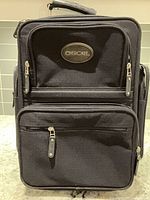 Front view showing Cherokee logo, exterior pockets, zipper pulls