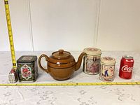 All items together with measuring tape and can for scale