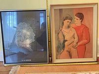 Both framed prints side by side for scale