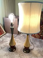 Both lamps side by side, one with shade, illuminated bulb shown
