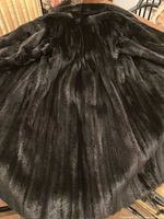 Back view of entire mink coat laid flat