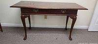 Full view of mahogany writing desk with cabriole legs