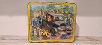 Front of The Waltons metal lunchbox showing illustration and border wear