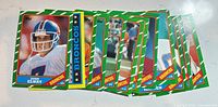 Stack of 1986 Topps Broncos cards fan-spread