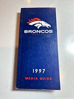 Front cover showing Broncos logo, title, and year