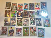 layout of 63 Broncos rookie football cards in sleeves