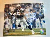 Full view of signed 8x10 photo showing player, autograph, and hologram