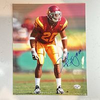 Full view of signed 8x10 photo showing player, signature, and hologram