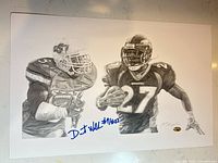 Full view of signed lithograph showing both player images and autograph