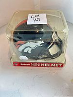 Mini helmet in original packaging showing team logo and Riddell branding