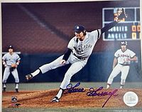 Front view of signed 8x10 photo showing full image, autograph, team uniform and sticker