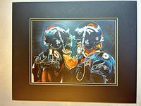 Full view of matted dual-signed Broncos print