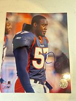 Front view of signed Jayshon Sykes 8x10 photo showing player image, full signature and hologram