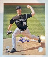 Full photograph showing Jeff Francis pitching with visible autograph and hologram sticker