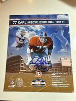 Full view of signed 8x10 photo showing autograph, edition badge and Broncos logo