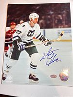 Full view of signed 8x10 photo with holograms visible