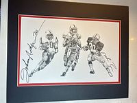 Full view of matted lithograph with three player sketches and signatures