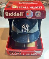 Front view of boxed New York Yankees Riddell mini helmet