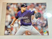 Full view of signed Taylor Buchholz 11x14 photo with holograms visible