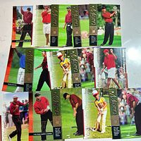 Spread of multiple Tiger Woods trading cards, front images visible