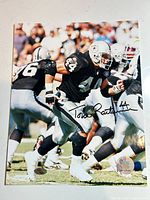 Full view of signed 8x10 photo showing autograph and hologram