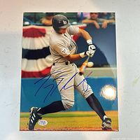 Full view of signed 8x10 photo with hologram sticker