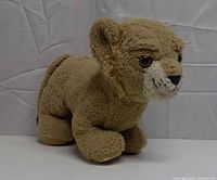 Front/side view of plush lion