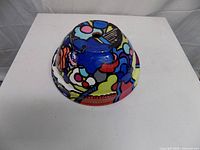 Upside-down view showing exterior abstract design and drainage hole