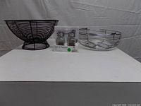 Front view of both baskets and packaged shakers