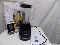 Blender assembled with lid, pitcher, base, manual and box
