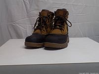 Front view of pair of brown and black Ozark Trail lace-up hiking boots